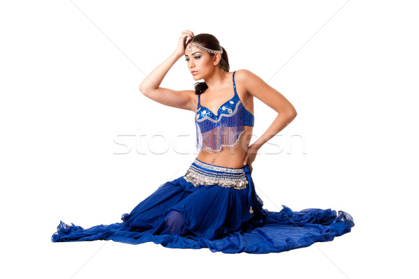 Belly dancer sitting in blue dress Stock photo © phakimata