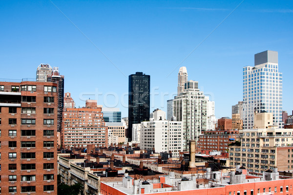 Edifício telhados blue sky ver cidade arranha-céu Foto stock © phakimata