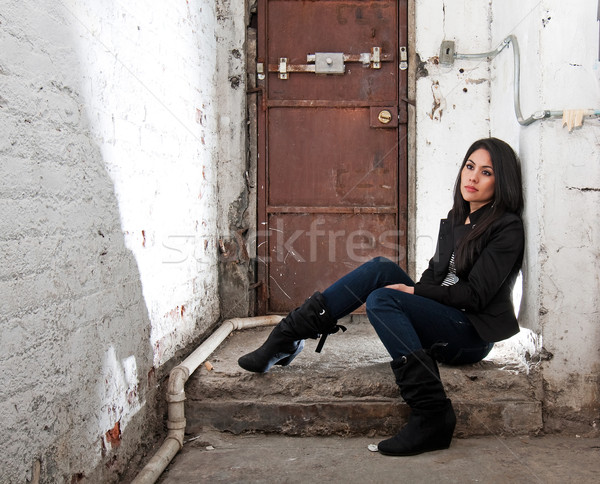 Girl sitting in basement Stock photo © phakimata