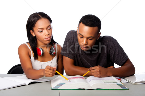 Students helping studying together Stock photo © phakimata