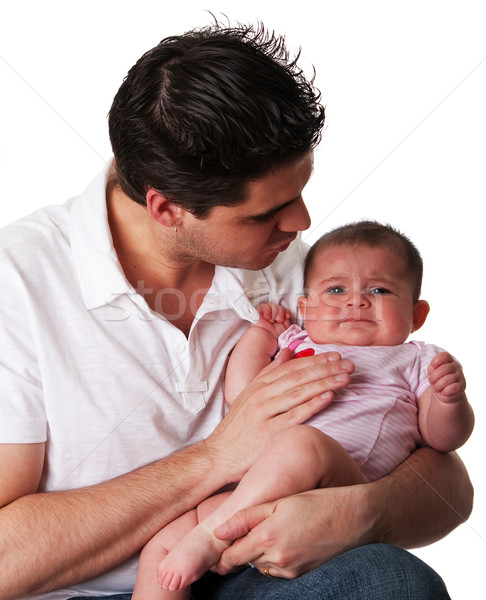Father calming unhappy baby daughter Stock photo © phakimata