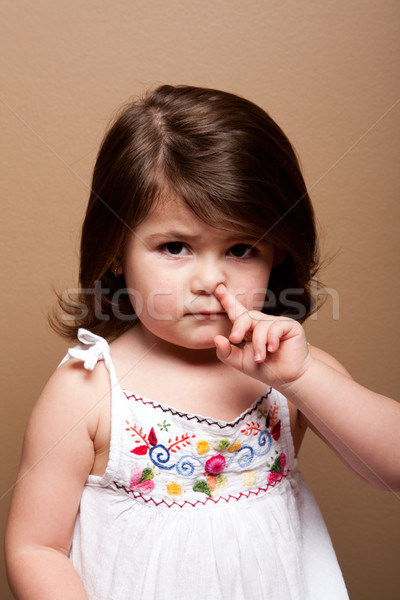 Toddler with finger in nose Stock photo © phakimata