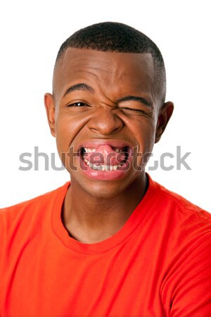 Vicces arckifejezés fiatalember humoros nyelv kidugva arc Stock fotó © phakimata