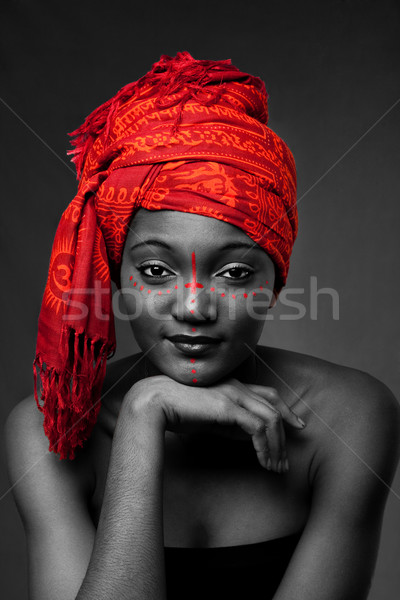 Tribal African woman with headwrap Stock photo © phakimata