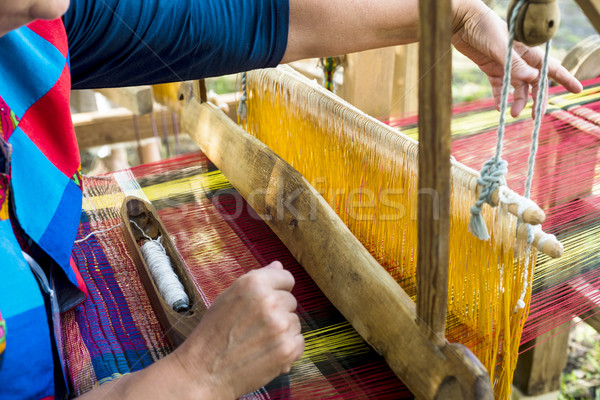 Stock photo: Weaving on a wooden loom