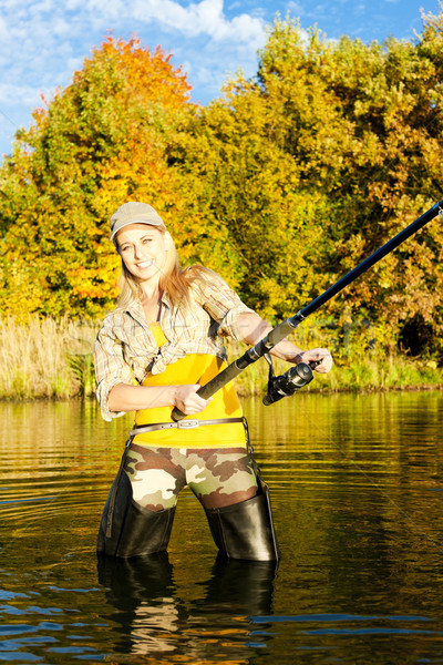 woman fishing in pond Stock photo © phbcz