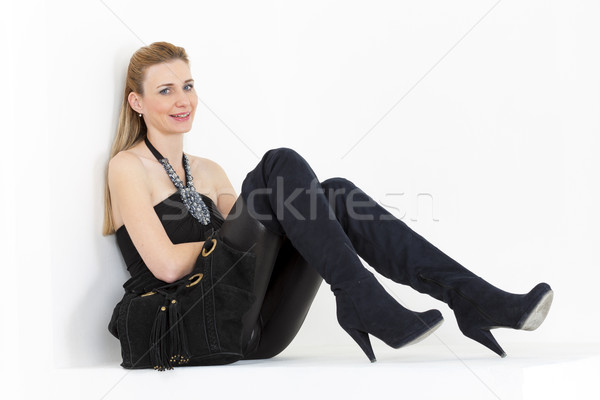 сидят женщину черный одежды сапогах Сток-фото © phbcz