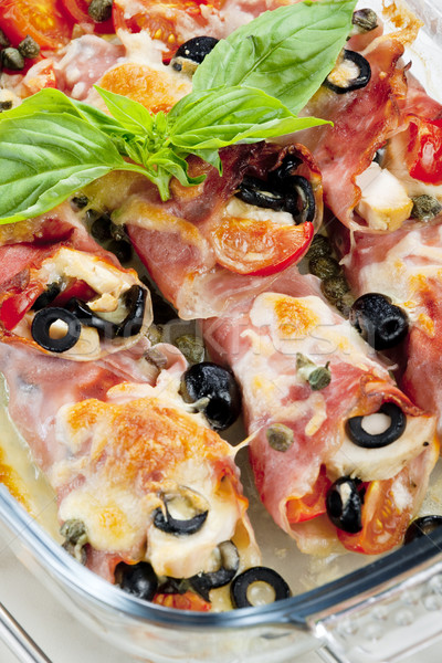 baked ham rolls filled with chicken meat and black olives Stock photo © phbcz