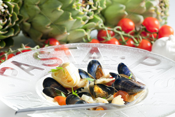 Stock photo: pasta with mussels, artichokes and cherry tomatoes