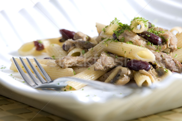 penne with pork pieces and champignons Stock photo © phbcz