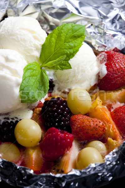 warm fruit salad with ice cream Stock photo © phbcz