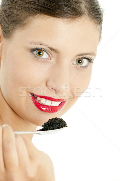 Portret kobieta czarny kawior młodych jedzenie Zdjęcia stock © phbcz