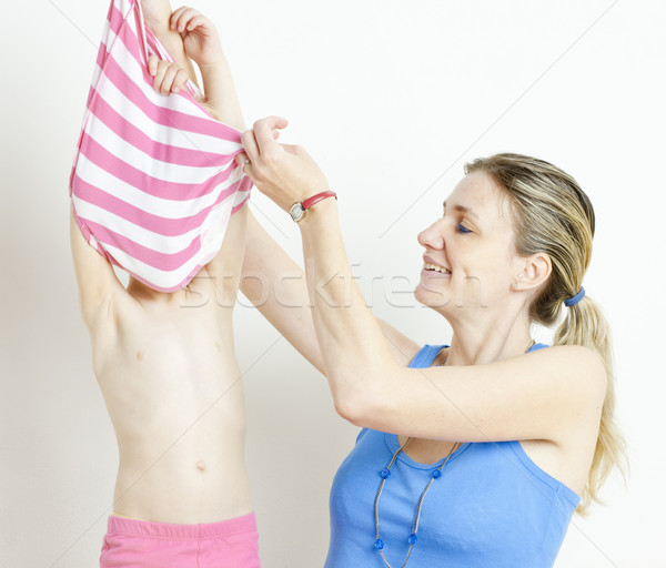 portrait of mother with her daughter during changing the clothes Stock photo © phbcz