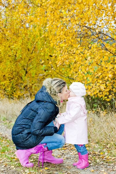 Stock photo: mother with her daughter in autumnal nature