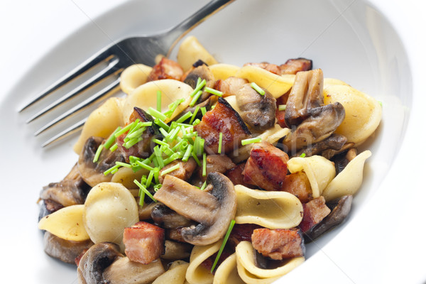 pasta orecchiette with fried champignons and bacon Stock photo © phbcz