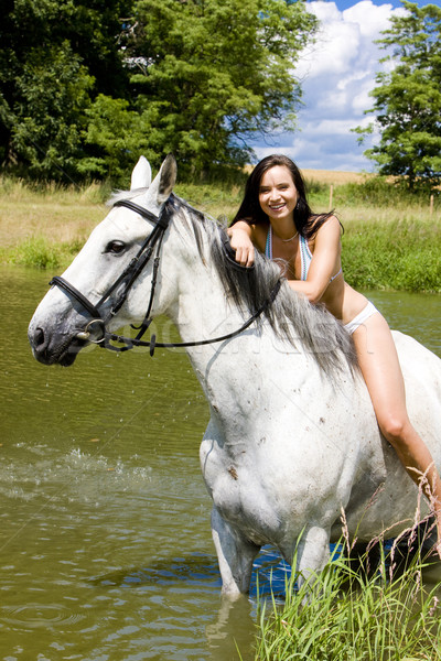 equestrian on horseback riding through water Stock photo © phbcz