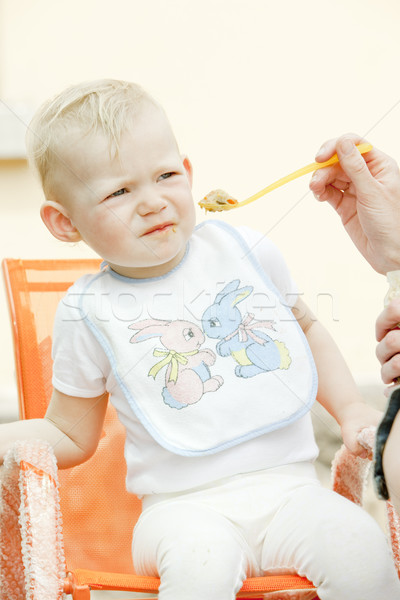 portrait of eating little girl Stock photo © phbcz