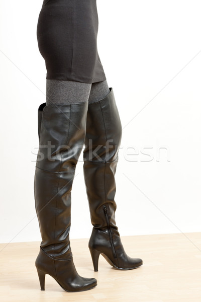 detail of standing woman wearing fashionable black boots Stock photo © phbcz