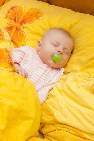 sleeping baby girl in big bed Stock photo © phbcz