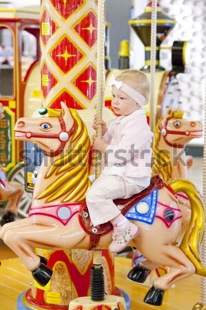 sitting toddler on carousel Stock photo © phbcz