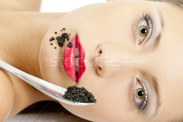 Portret vrouw zwarte kaviaar jonge eten Stockfoto © phbcz