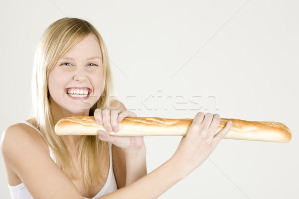 Stock photo: portrait of woman holding a baguette