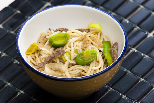 Stock photo: Asian noodles with beef meat and leek