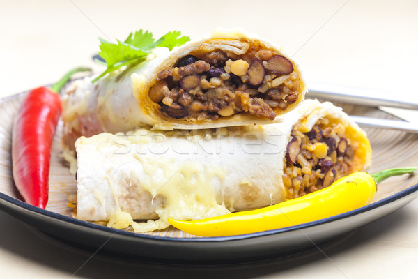 burrito filled with beef minced meat and beans baked with gouda  Stock photo © phbcz