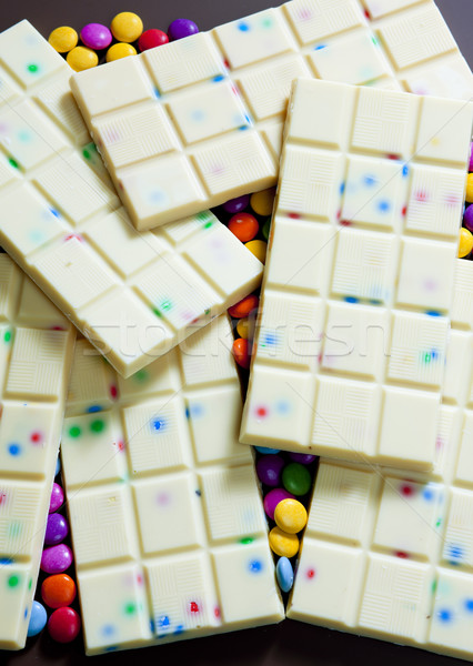 still life of white chocolate with smarties Stock photo © phbcz