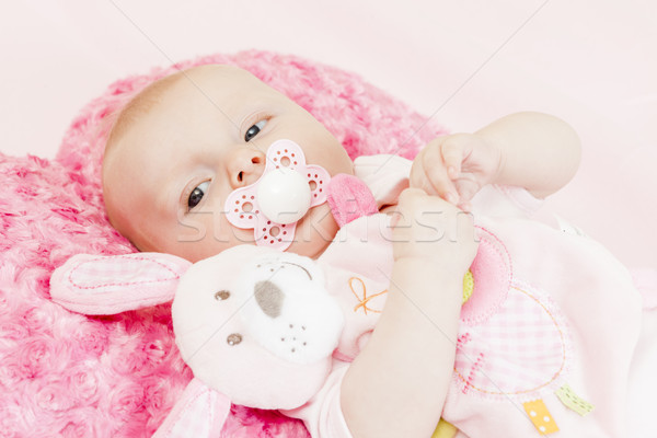 portrait of three months old baby girl with a toy Stock photo © phbcz