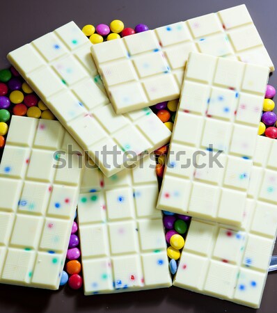 still life of white chocolate with smarties Stock photo © phbcz