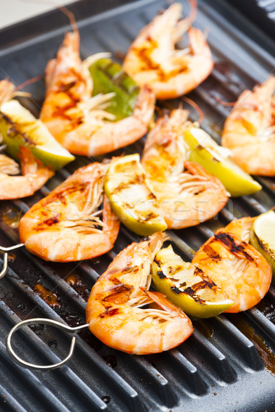 prawn skewers with lime on electric grill Stock photo © phbcz