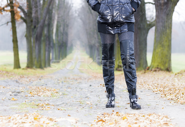 detail of woman wearing black clothes and boots in autumnal alle Stock photo © phbcz