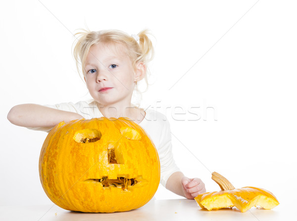 little girl carving pumpkin for Halloween Stock photo © phbcz