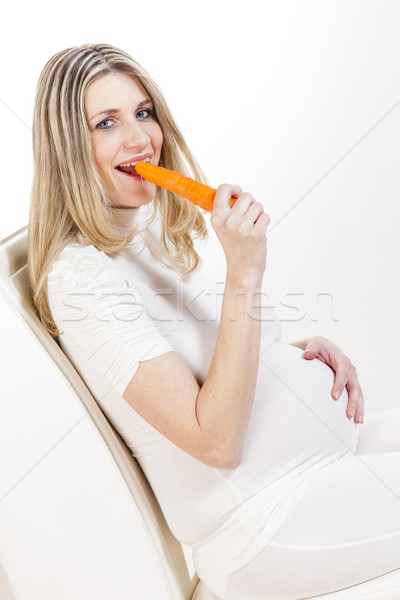 Portrait femme enceinte manger carotte femmes président [[stock_photo]] © phbcz