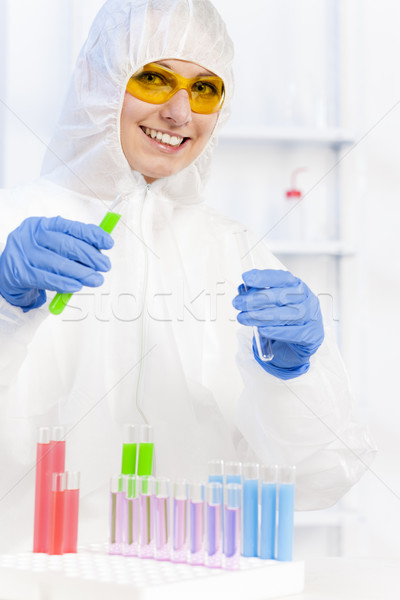young woman wearing protective coat in laboratory Stock photo © phbcz