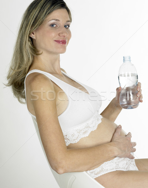 pregnat woman with a bottle of water Stock photo © phbcz