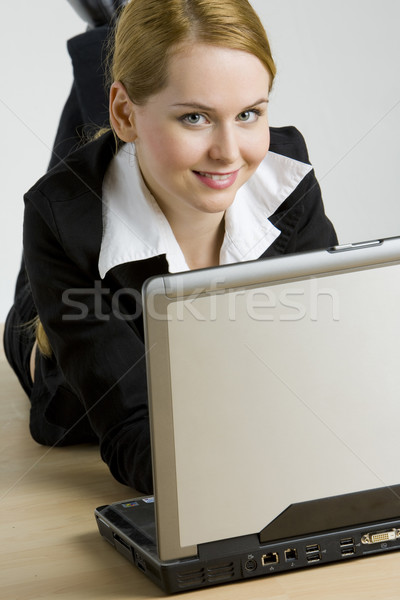 lying businesswoman with a notebook Stock photo © phbcz