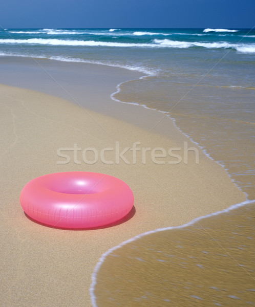 Borracha anel praia água mar areia Foto stock © phbcz