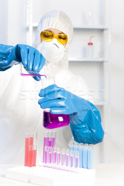 young woman wearing protective coat in laboratory Stock photo © phbcz