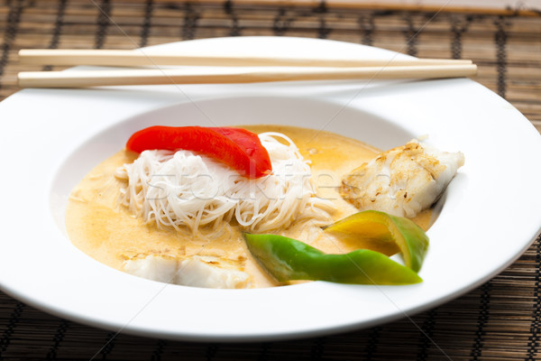 Thai curry with cod and rice noodles Stock photo © phbcz