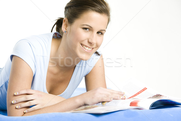 portrait of lying down woman with a journal Stock photo © phbcz