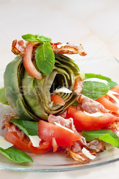 cooked artichoke with tomatoes, parmesan cheese, pancetta, and m Stock photo © phbcz