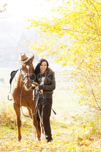 equestrian with her horse in autumnal nature Stock photo © phbcz