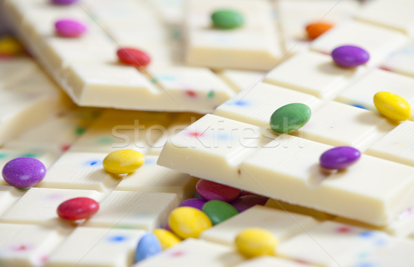 still life of white chocolate with smarties Stock photo © phbcz