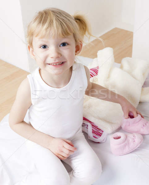 little girl with clothes and shoes for a baby Stock photo © phbcz