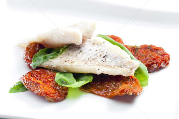 cod with dried tomatoes and basil Stock photo © phbcz
