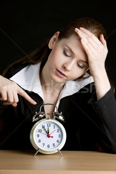 portrait of businesswoman with an alarm clock Stock photo © phbcz