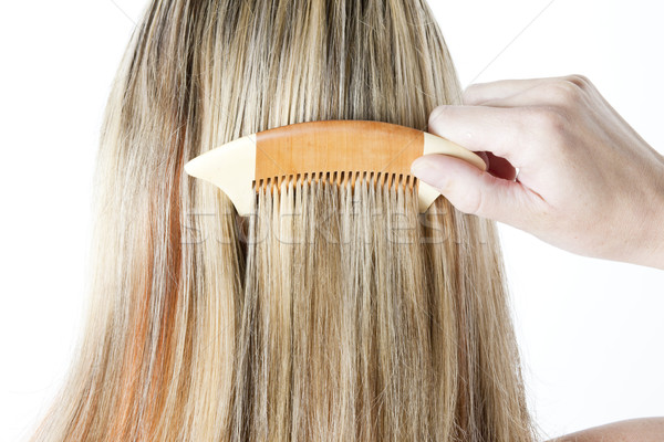 detail of woman combing long hair Stock photo © phbcz