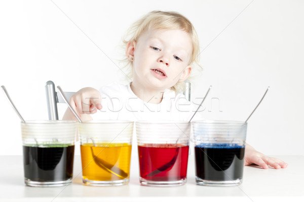 little girl during Easter eggs'' coloration Stock photo © phbcz